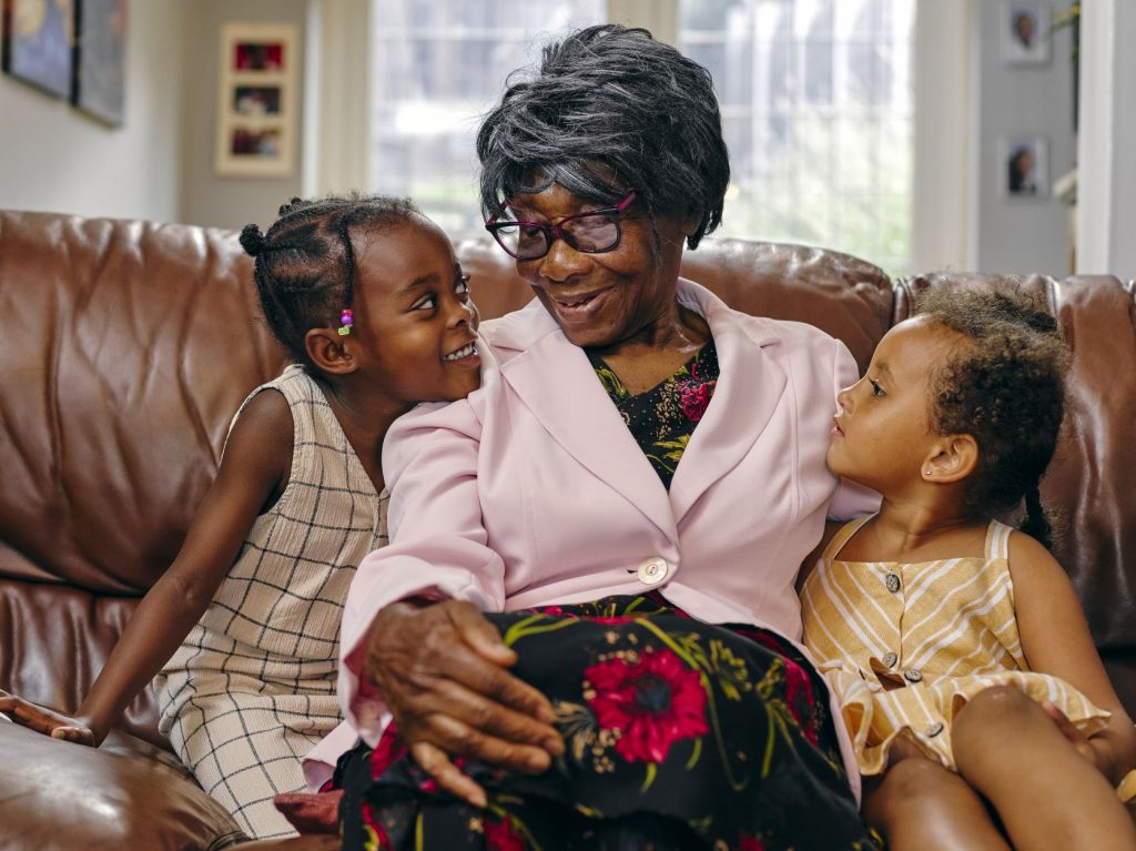 Senior Woman with Grandkids - Open Arms Solutions